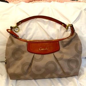 Orange and tan Coach bag.